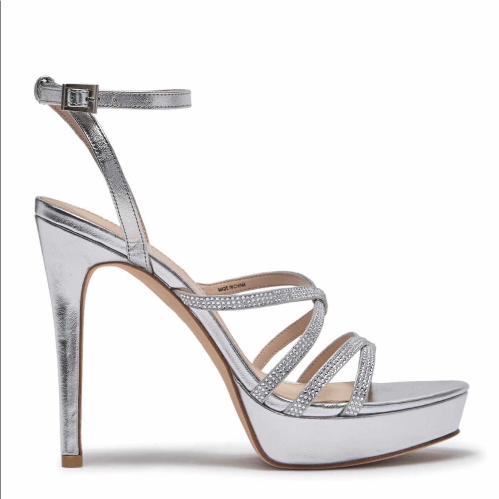 NIB Pelle Moda Silver heels with lots of bling.